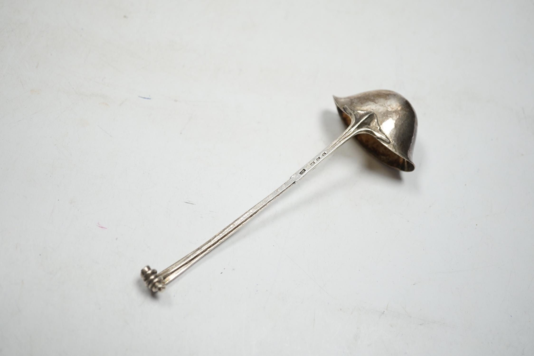A George V Arts & Craft silver cream ladle by Omar Ramsden, London, 1934, 16.7cm, 49 grams.